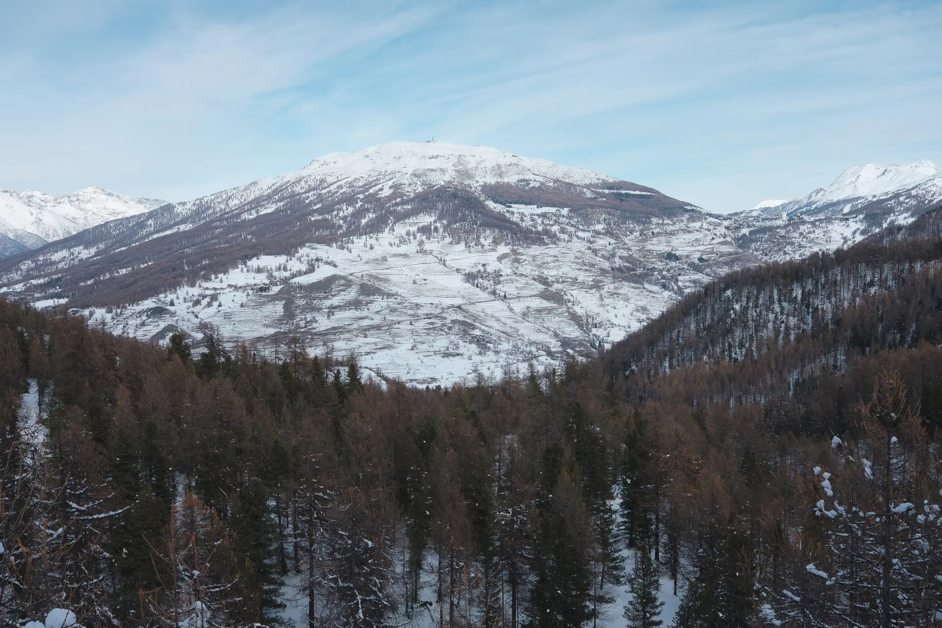 Wide-angle landscape photography of alpine peaks during a snow trek to Bousson